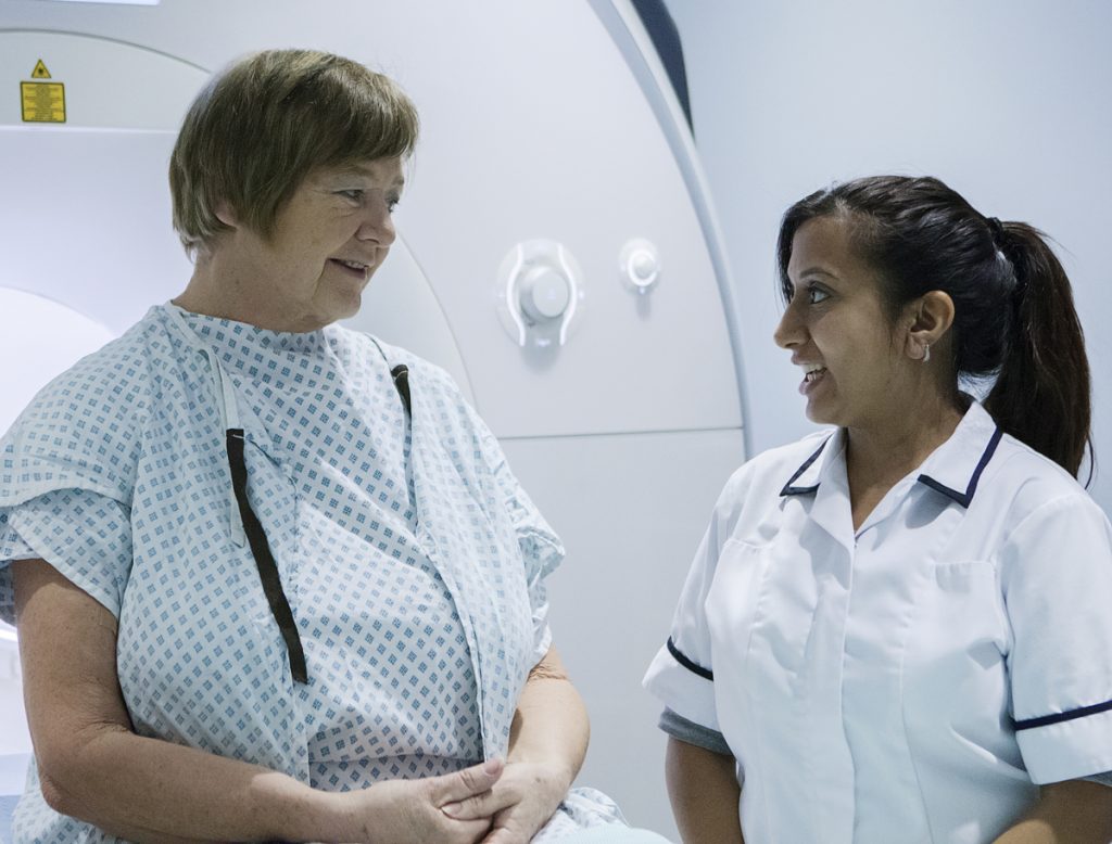 Radiographer with a patient