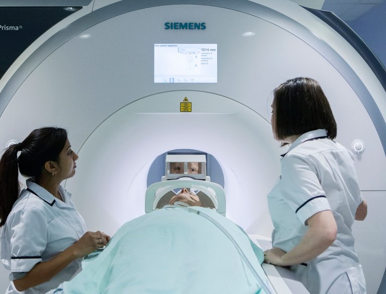 Radiographers and a scanner
