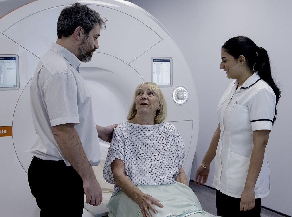 Radiographers and a patient